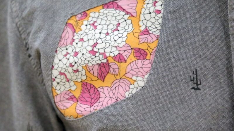 A photograph of floral patchwork on a piece of clothing