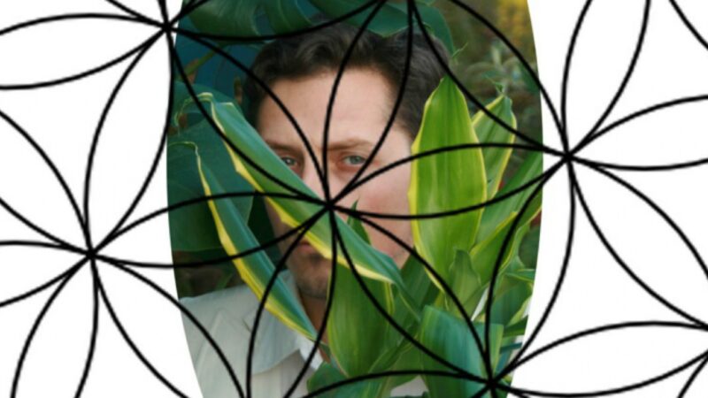 A headshot of a person behind some leaves with a mandala graphic over the image