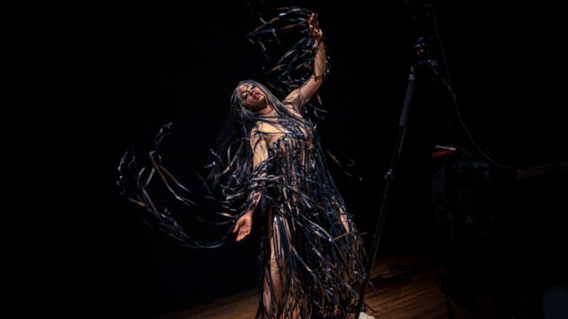 Nwando Ebizie performing Distorted Constellations in theatrical clothing