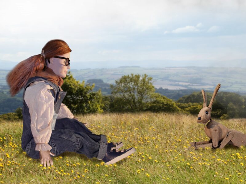 Still from Amser Stori of an amimated girl with a hare in a field