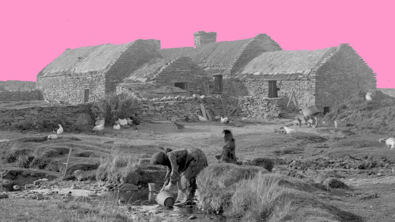 Black and white archive picture of a rural house on Orkney with a woman collecting water from a stream in a bucket in the foreground.