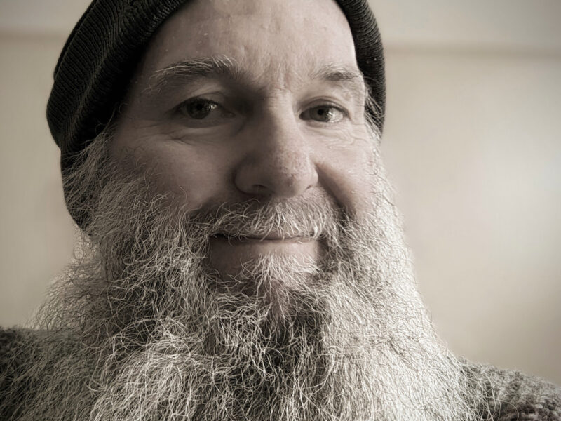 Al Davidson with a long grey beard and wearing a black beanie.