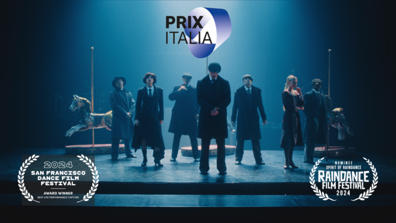 Scene from Rambert's dance film Peaky Blinders: The Redemption of Thomas Shelby. People on stage are dressed in 1940's clothing.