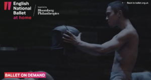 A bare chested male dancer holds out his arms. English National Ballet at Home