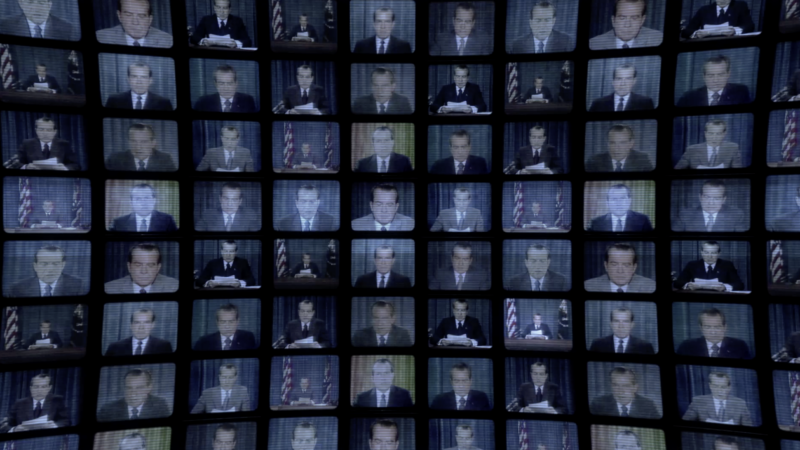 A wall of TV screens - all showing an image of Richard Nixon