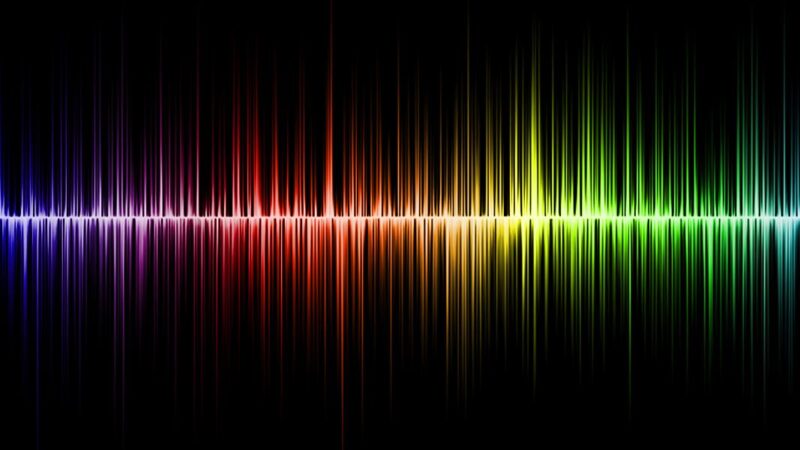 Colourful sound wave against a black background.
